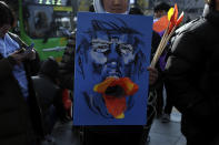 <p>South Korean protesters take part in an anti-Trump rally in front of U.S. Embassy on Nov. 4, 2017 in Seoul, South Korea. (Photo: Woohae Cho/Getty Images) </p>