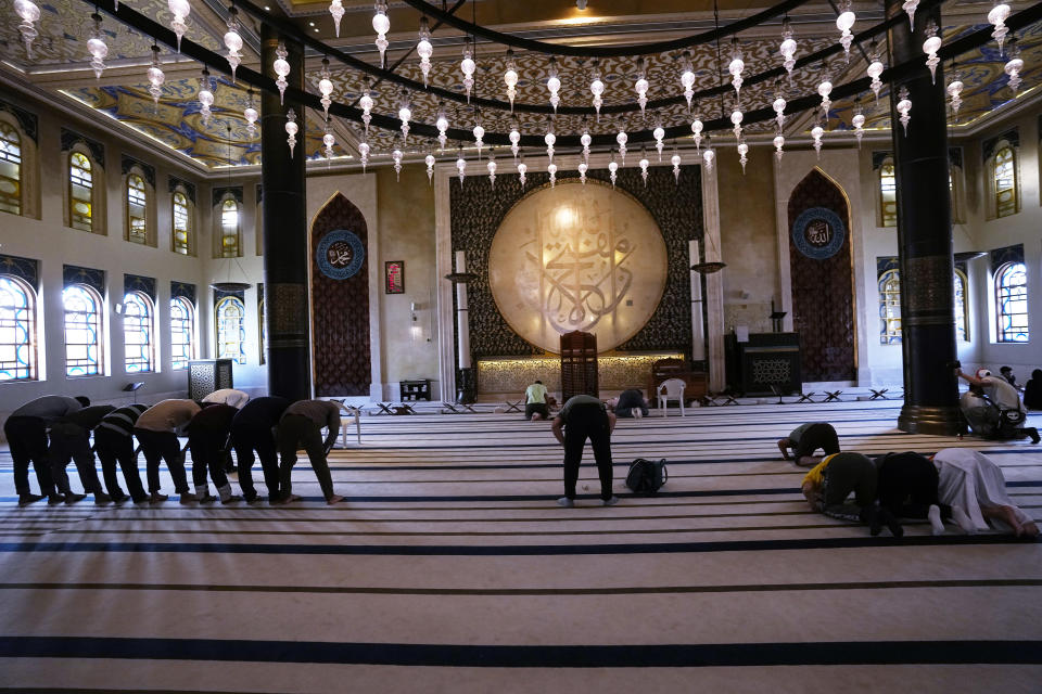 Men pray at Katara "blue" mosque, in Doha, Qatar, Thursday, Nov. 24, 2022. (AP Photo/IJorge Saenz)