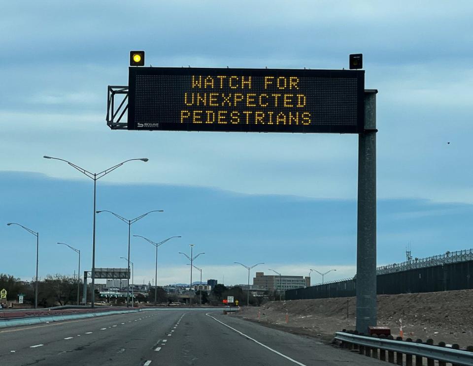 A sign along Loop 375 in El Paso near the U.S.-Mexico border warns motorists to be on the lookout for pedestrians who might try to cross the road.