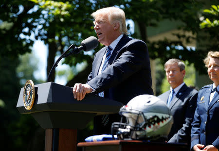 U.S. President Donald Trump speaks as he presents the U.S. Air Force Academy football team with the Commander-in-Chief trophy in the Rose Garden of the White House in Washington, U.S., May 2, 2017. REUTERS/Joshua Roberts