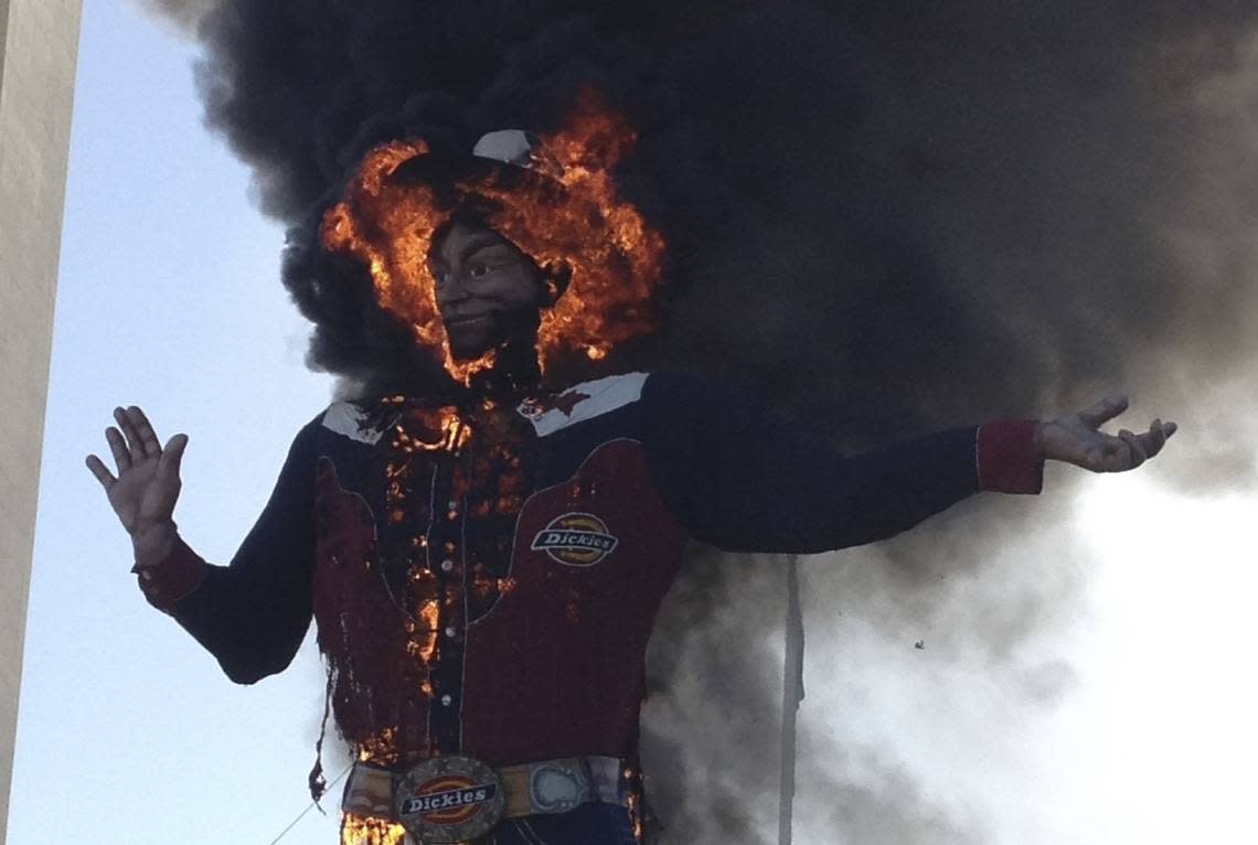 Fire engulfs the Big Tex cowboy statue displayed at the State Fair of Texas in Dallas on Friday, Oct. 19, 2012. The iconic structure caught fire and burned this morning.