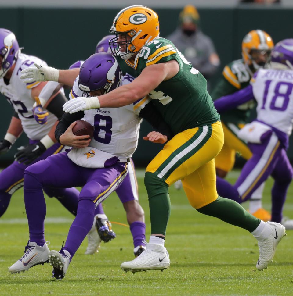 Green Bay Packers defensive end Dean Lowry (94) sacks Minnesota Vikings quarterback Kirk Cousins (8) during the second quarter of their game Sunday, November 1, 2020 at Lambeau Field in Green Bay, Wis,