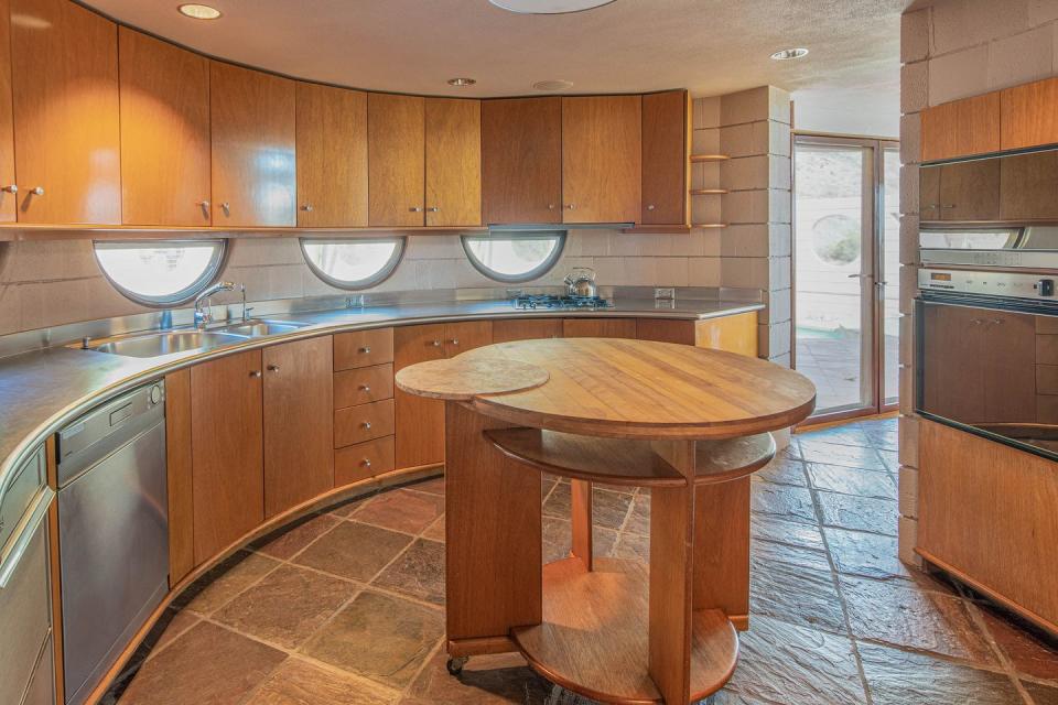 6) The kitchen has everything from a Wright-designed rolling island to windows under the cabinets.