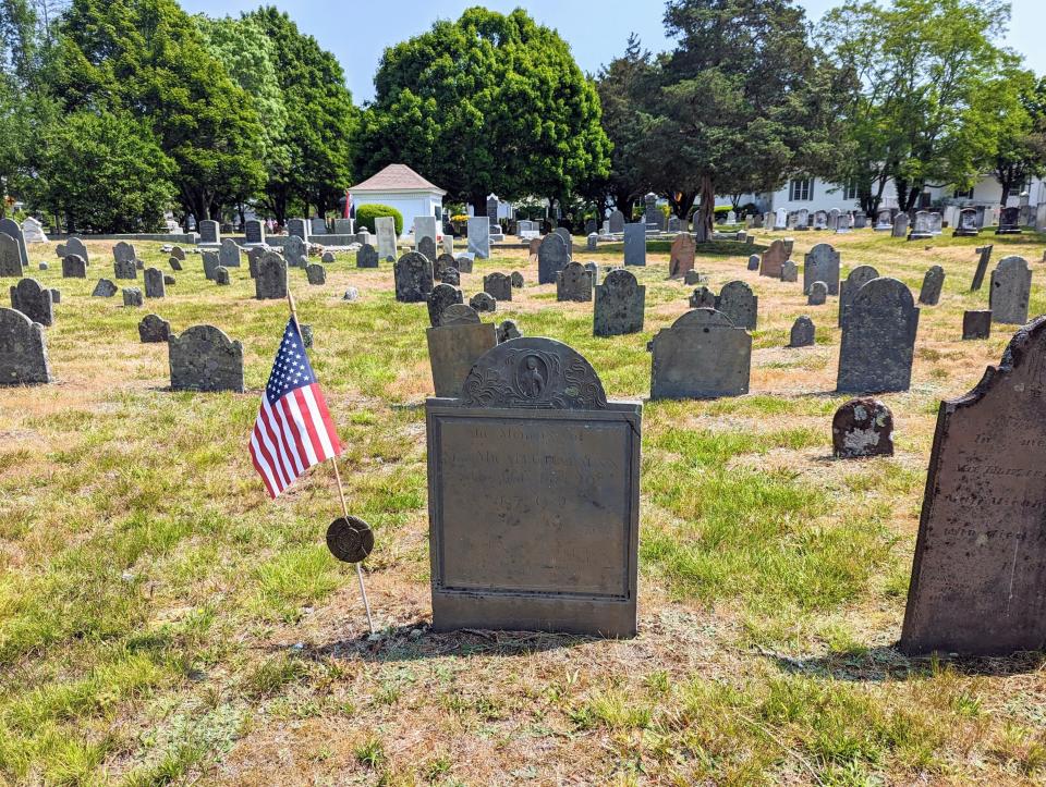 Dennis Village Cemetery in 2023, where veterans' graves are marked with new American flags for Memorial Day and Veteran's Day.