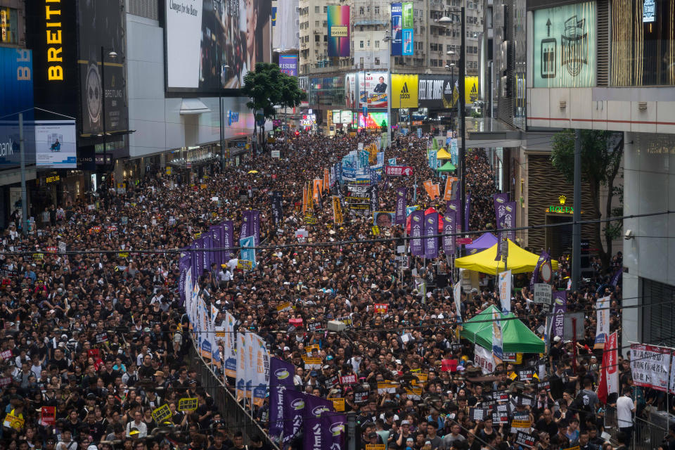 HONG KONG, HONG KONG - JULY 01: Protesters take part in a rally against extradition bill on July 1, 2019 in Hong Kong, China. Thousands of pro-democracy protesters faced off with riot police on Monday during the 22nd anniversary of Hong Kong's return to Chinese rule as riot police officers used batons and pepper spray to push back demonstrators. The city's embattled leader Carrie Lam watched a flag-raising ceremony on a video display from inside a convention centre, citing bad weather, as water-filled barricades were set up around the exhibition centre.(Photo by Billy H.C. Kwok/Getty Images)