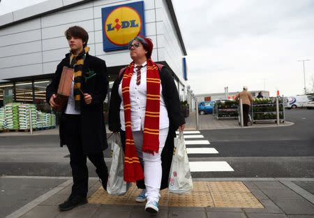 Harry Potter fans Tracey Nicole-Lewis and her son Brenden, shop dressed as characters from the literary franchise in Cardiff, Britain, April 12, 2017. REUTERS/Neil Hall