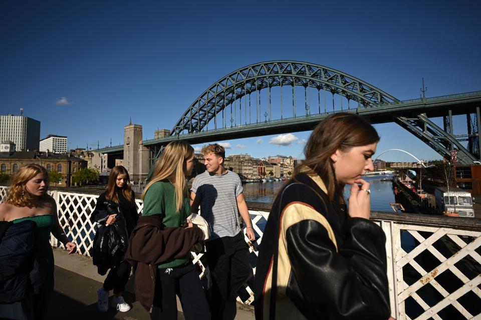 People walk across the Swing Bridge, near the Tyne Bridge in NewcastleAFP via Getty Images