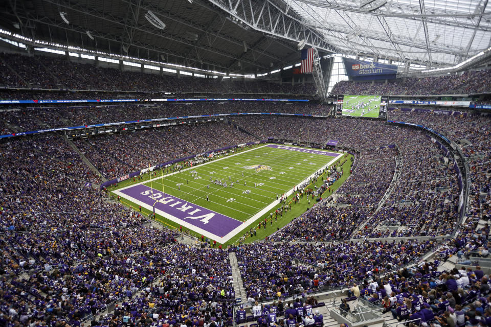 FILE - In this Sept. 8, 2019, file photo, fans cheer in U.S. Bank Stadium during the second half of an NFL football game between the Minnesota Vikings and the Atlanta Falcons, in Minneapolis. The Minnesota Vikings will play at least their first two home games without fans in attendance. With current Minnesota Department of Health guidelines specifying an indoor venue capacity of 250 people, officials from the Vikings, the state, U.S. Bank Stadium, the NFL and the city of Minneapolis were unable to establish a prudent way to open the gates to the public for now. The Vikings will host Green Bay on Sept. 13, 2020, and Tennessee on Sept. 27 with the 66,000 seats empty. (AP Photo/Bruce Kluckhohn, File)