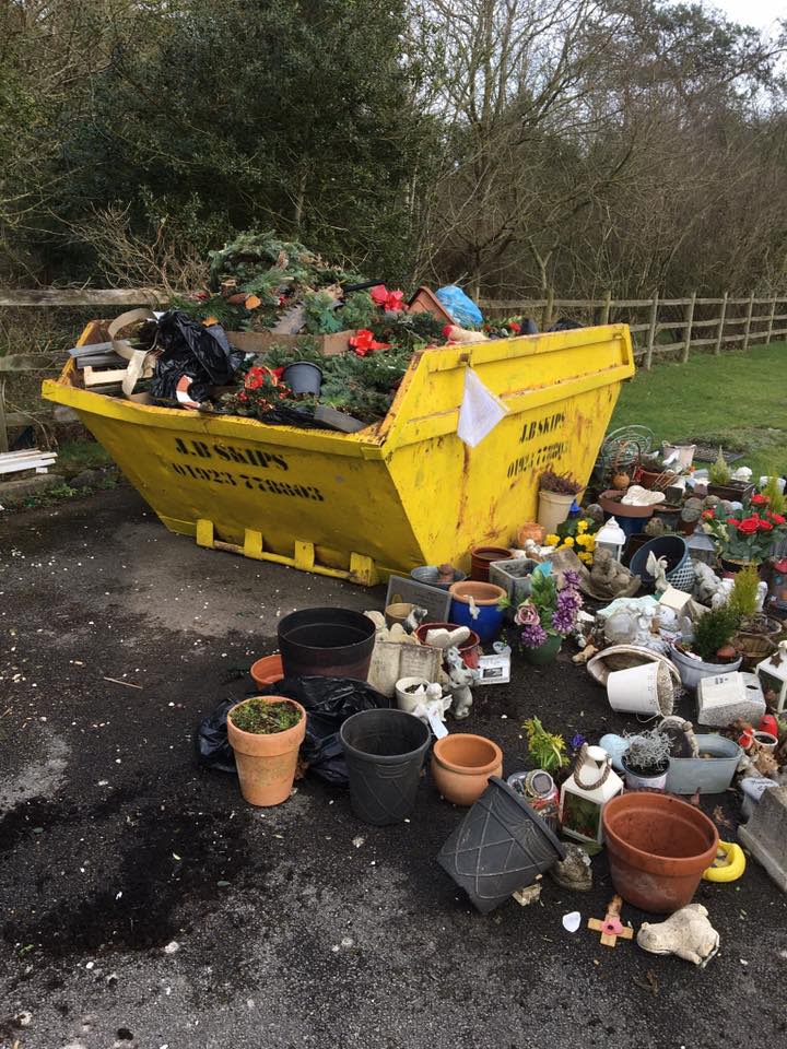 Treasures left at gravesides were thrown into a skip by council workers clearing Parkside Cemetary, Bucks (Ann Sibley/Facebook)