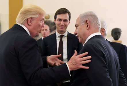 FILE PHOTO: Israel's Prime Minister Benjamin Netanyahu and U.S. President Donald Trump chat as White House senior advisor Jared Kushner is seen in between them, during their meeting at the King David hotel in Jerusalem May 22, 2017. Kobi Gideon/Courtesy of Government Press Office/Handout via Reuters/File Photo