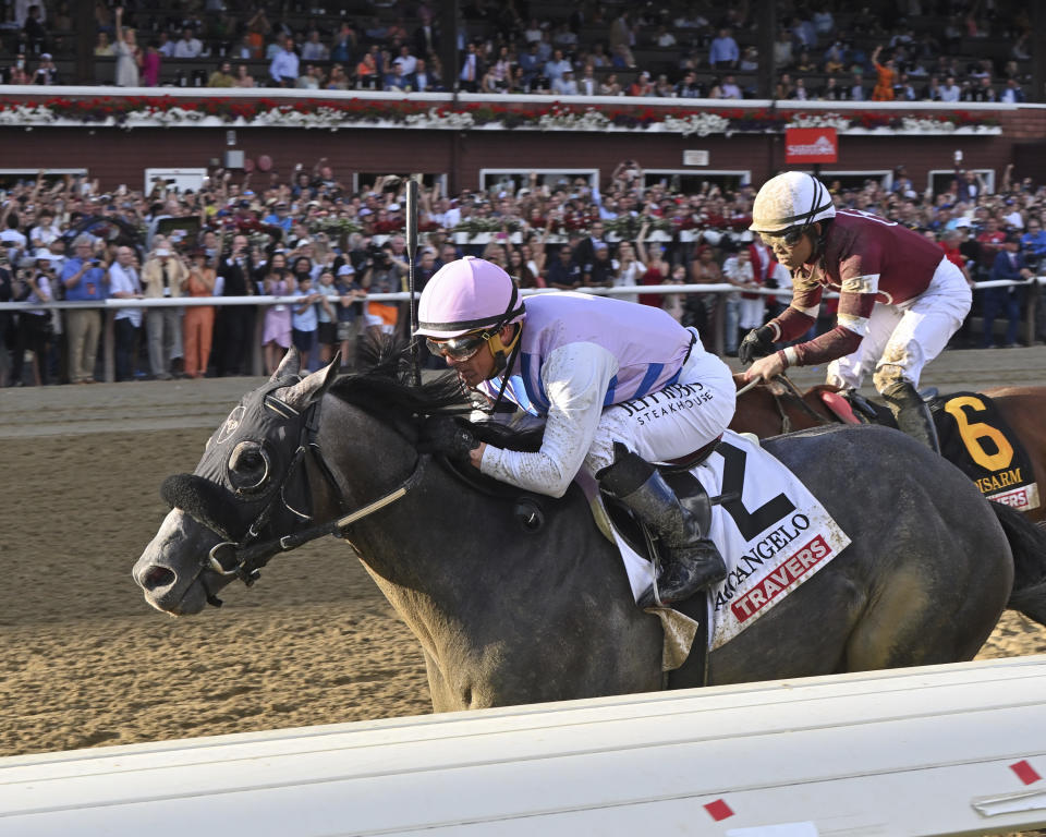 In this photo provided by NYRA, Arcangelo (2), with Javier Castellano aboard, wins the Travers Stakes horse race at Saratoga Race Course in Saratoga Springs, N.Y., Saturday, Aug. 26, 2023. (Chelsea Durand/NYRA via AP)