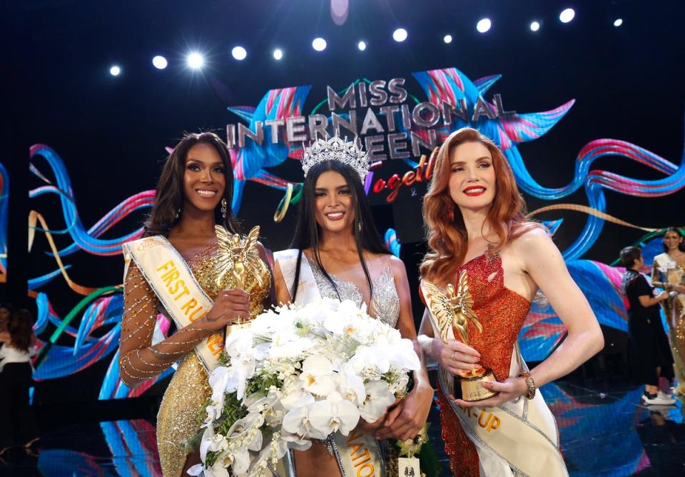 Fuschia Anne Ravena, the Miss International Queen 2022, is flanked by first runner-up ‘Miss Colombia’ Jasmine Jimenez and second runner-up ‘Miss France’ Aela Chanel  (EPA)