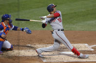 Washington Nationals' Juan Soto, right, watches his two-run home run during the third inning of a baseball game against the New York Mets, Monday, Aug. 10, 2020, in New York. Mets catcher Wilson Ramos, left, looks on. (AP Photo/Kathy Willens)