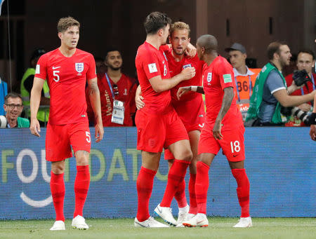 Soccer Football - World Cup - Group G - Tunisia vs England - Volgograd Arena, Volgograd, Russia - June 18, 2018 England's Harry Kane celebrates with Harry Maguire and Ashley Young after scoring their second goal REUTERS/Toru Hanai