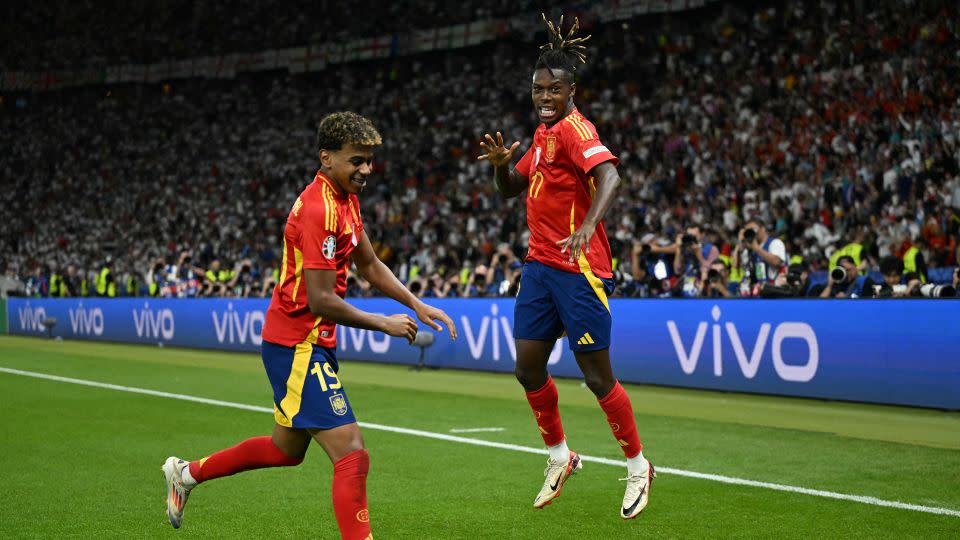 Nico Williams (right) celebrates with his teammate Lamine Yamal after scoring Spain's first goal against England in the Euro 2024 final. - Ina Fassbender/AFP/Getty Images