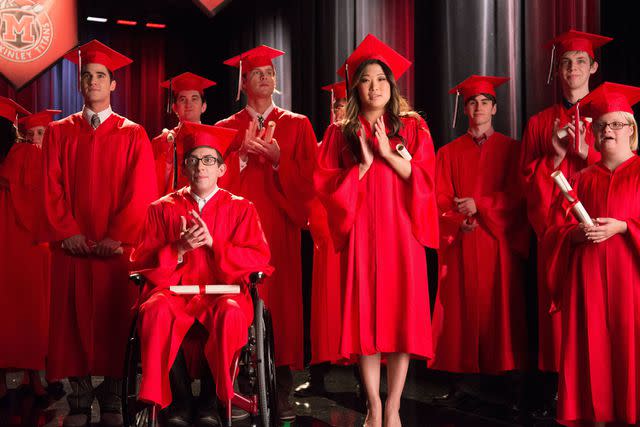 FOX Image Collection via Getty Kevin McHale and Jenna Ushkowitz stand front and center during an episode of "Glee"