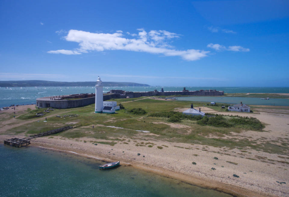 <p>Hurst Castle in Hampshire stretches out into the turquoise sea. </p>