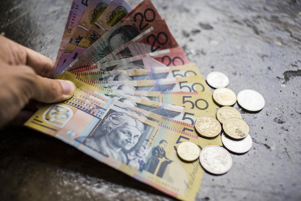 Australian dollar banknotes and coins are pictured in Hong Kong. Photo: studioEAST/Getty Images
