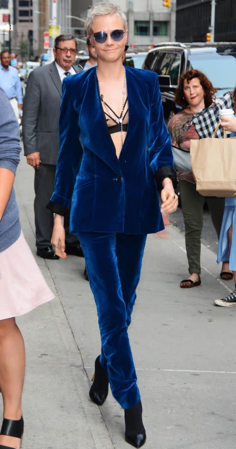<p><strong> July 2017</strong> Cara Delevingne channelled Jimi Hendrix in a blue velvet suit while out in New York, which she paired with stiletto boots and a mesh bralet.</p>