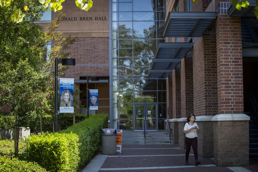 Irvine, CA - June 29: A person walks past the Donald Bren School of Information and Computer Sciences, located in the Bren Hall building at UCI, Irvine, CA on Wednesday, June 29, 2022. Former UCI student, Sebastian Dumbrava, who over the past two years has cycled in and out of jail for threatening to commit a mass shooting on the UCI campus. Dumbrava was a computer science major within the Donald Bren School of Information and Computer Sciences. That school is located in the Bren Hall building on campus. (Allen J. Schaben / Los Angeles Times)