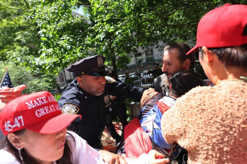 The scuffle broke out when an anti-Trump protesters started an anti-Israel chant. Photo by Michael M. Santiago/Getty Images