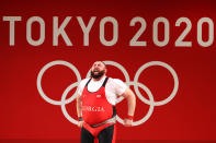 <p>Team Georgia's Lasha Talakhadze gets emotional after lifting 265kg to break the world record and win gold during the Weightlifting - Men's +109kg Group A at Tokyo International Forum on August 4.</p>