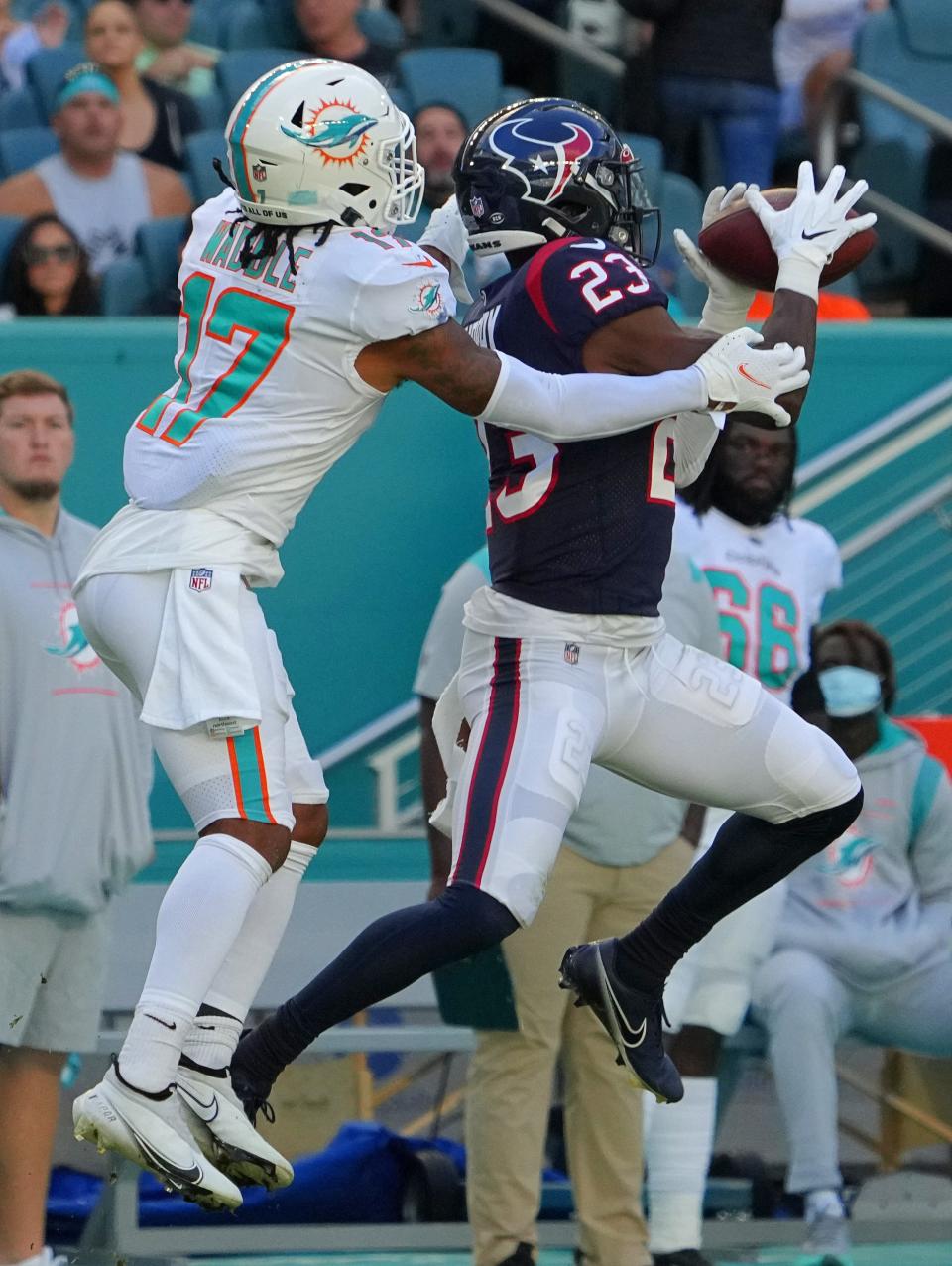 Houston Texans free safety Eric Murray (23) intercepts the a pass intended for Miami Dolphins wide receiver Jaylen Waddle (17) during the first half of a 2021 game.