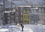 A resident digs a path from his house in St. John's, Newfoundland on Saturday, January 18, 2020. The state of emergency ordered by the City of St. John's is still in place, leaving businesses closed and vehicles off the roads in the aftermath of the major winter storm that hit the Newfoundland and Labrador capital. (Andrew Vaughan/The Canadian Press via AP)