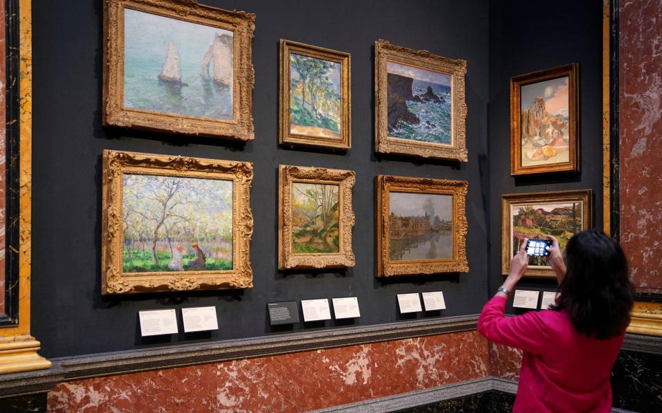 Curator Dr Rebecca Birrell displays works by Claude Monet at the Fitzwilliam