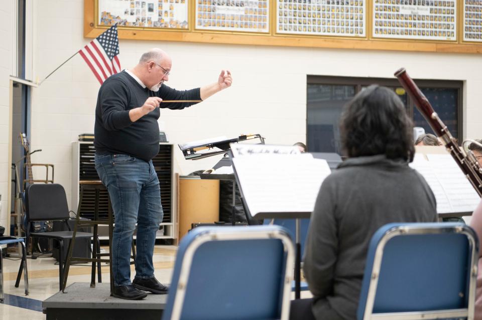 Conductor Stephen White works with the Cereal City Concert Band during a rehearsal at Battle Creek Central High School on Monday, March 11, 2024.