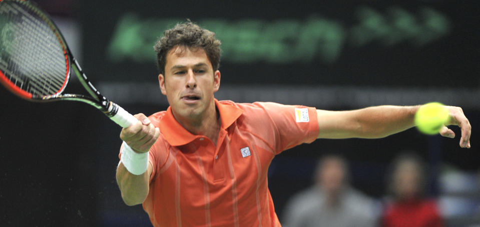 Robin Haase from the Netherlands returns the ball to Radek Stepanek from the Czech Republic during their opening single of the tennis Davis Cup 1st round match in Ostrava, Friday, Jan. 31, 2014. (AP Photo/CTK, Jaroslav Ozana) SLOVAKIA OUT