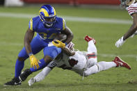 Los Angeles Rams running back Malcolm Brown (34) is tackled by San Francisco 49ers middle linebacker Fred Warner (54) during the second half of an NFL football game in Santa Clara, Calif., Sunday, Oct. 18, 2020. (AP Photo/Jed Jacobsohn)