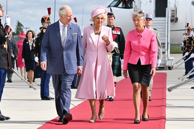 French Prime Minister, Elisabeth Borne, right, welcomes the King and Queen