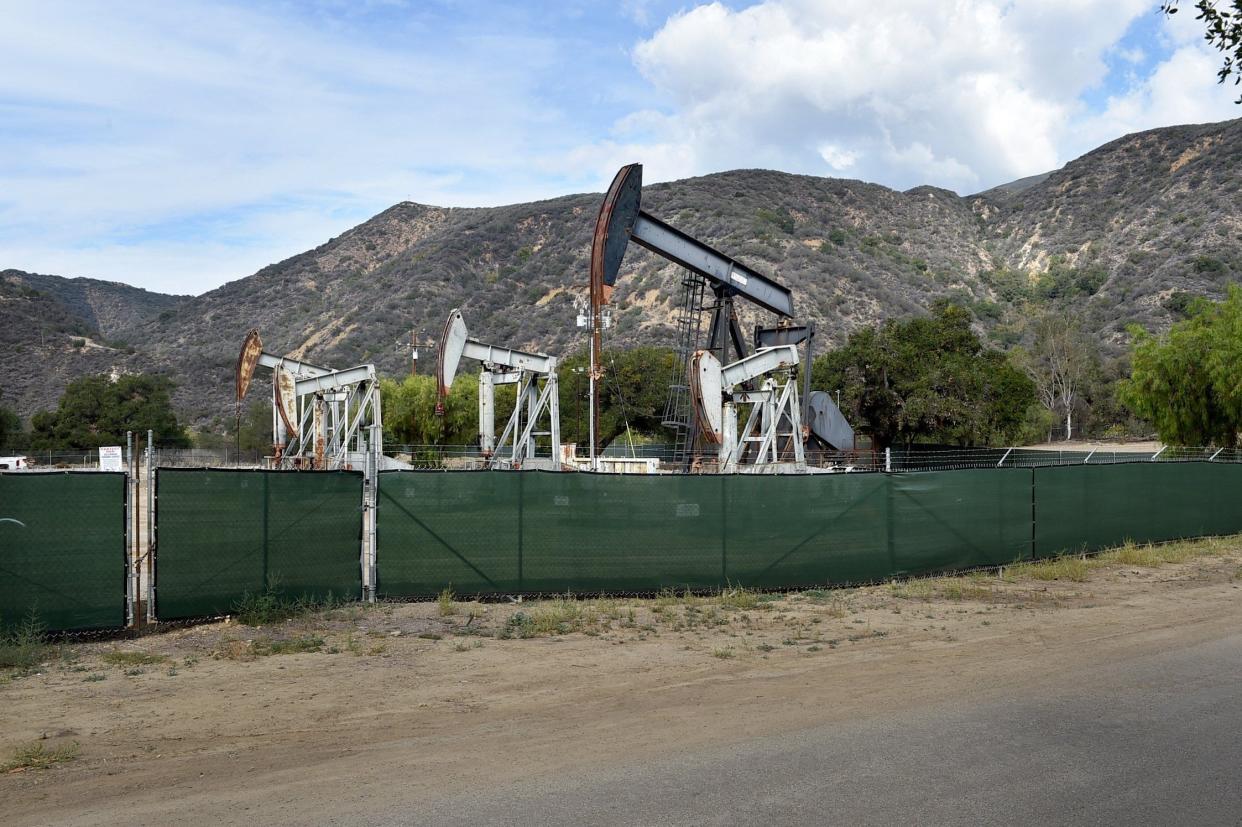 Oil wells tower above the Santa Paula Canyon trailhead.