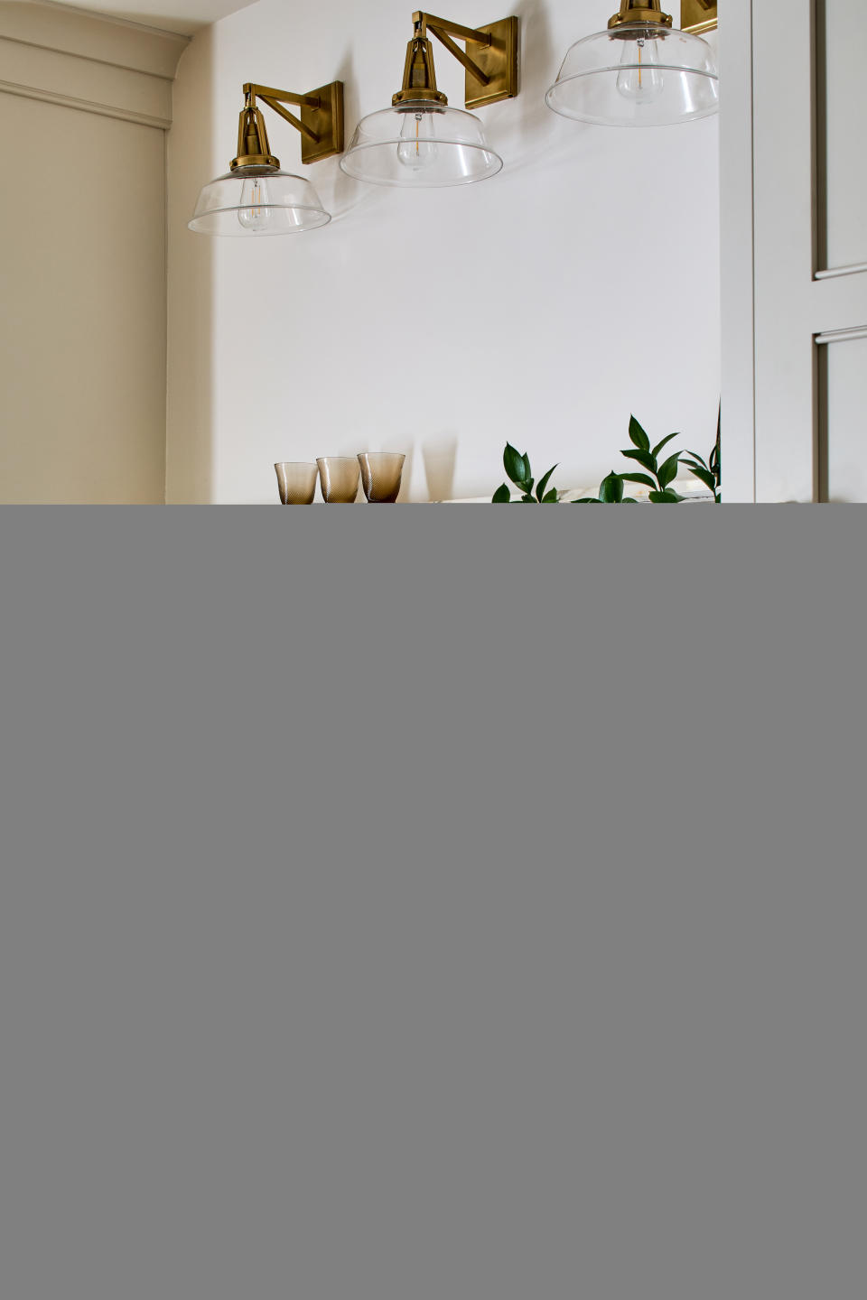 A kitchen with a veined marble backsplash