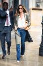 Cindy Crawford stays shielded from the rain during a Monday walk with her family in New York City.