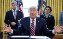 FILE PHOTO: U.S. President Trump participates in coronavirus relief bill signing ceremony at the White House in Washington