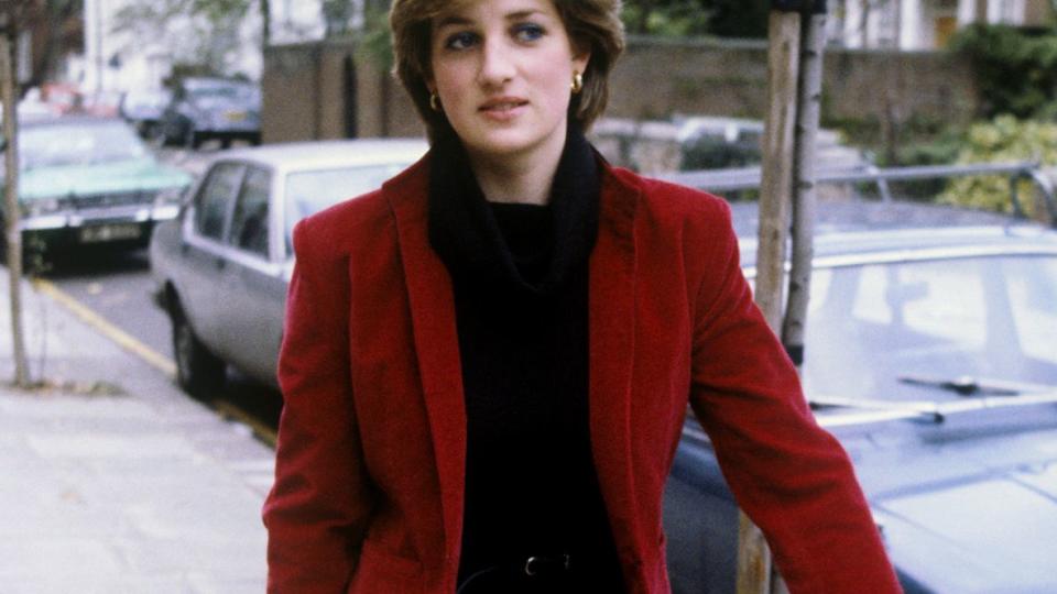 Lady Diana Spencer (later the Princess of Wales), who has been linked romantically with the Prince of Wales, being pursued by the Press near her London flat. Nineteen, she is the daughter of Earl Spencer