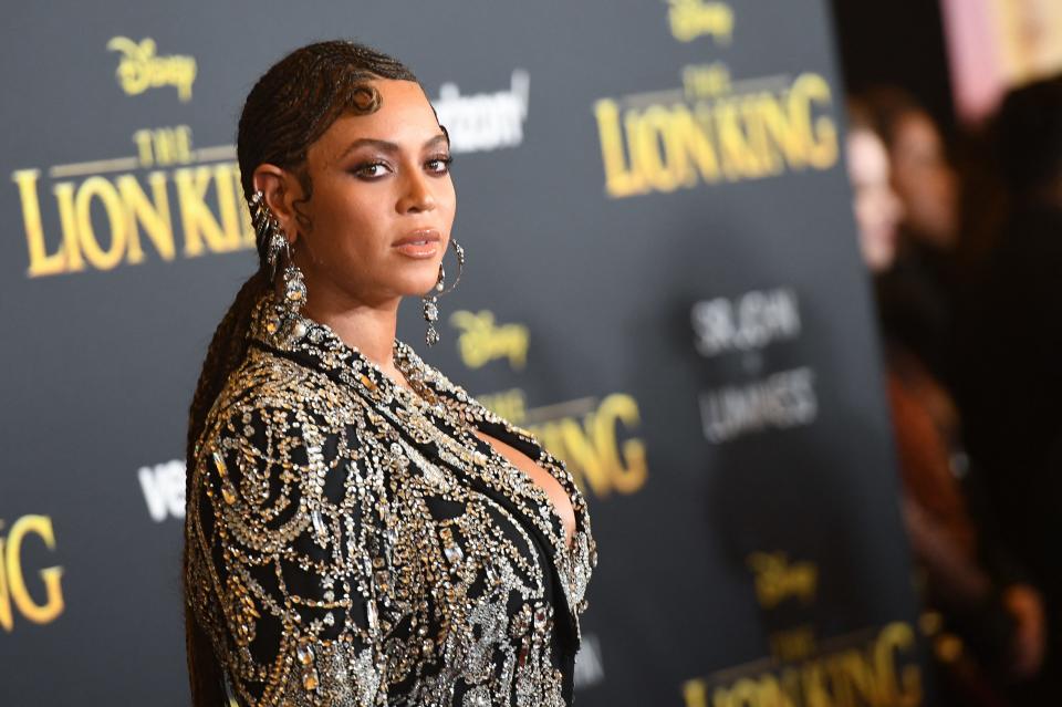 Beyoncé in a beaded gown with long braided hair at "The Lion King" premiere