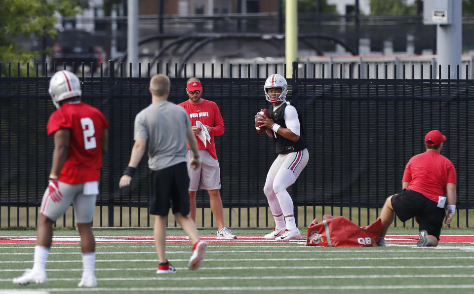 Ohio State quarterback Justin Fields drops back to pass during NCAA college football practice, Friday, Aug. 2, 2019, in Columbus, Ohio. (AP Photo/Jay LaPrete)