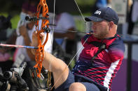 Matt Stutzman of the U.S. holds the bow with his foot as he competes in the Archery men's individual compound-open event at the Tokyo 2020 Paralympic Games, Friday, Aug. 27, 2021, in Tokyo, Japan. (AP Photo/Shuji Kajiyama)