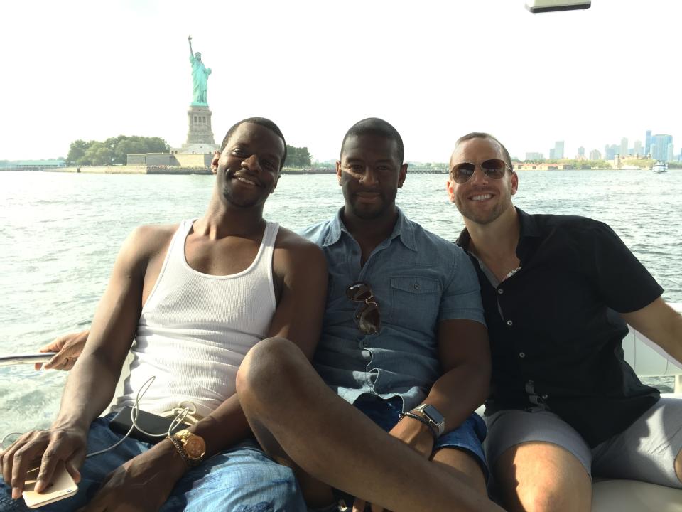 Brothers Marcus and Andrew Gillum and lobbyist/friend Adam Corey during a New York harbor boat ride with undercover FBI agents.