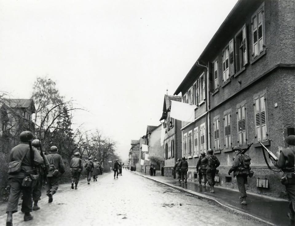 The 180th Infantry Regiment is shown on the march in Bensheim, Germany, on March 27, 1945.