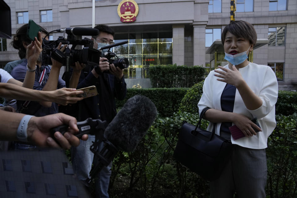 Teresa Xu speaks to journalists before her court session at the Chaoyang People's Court in Beijing, China on Sept. 17, 2021. A Beijing court overruled a rare legal challenge brought by an unmarried Beijing woman in court for the right to freeze her eggs on Friday, July 22, 2022. (AP Photo/Ng Han Guan)
