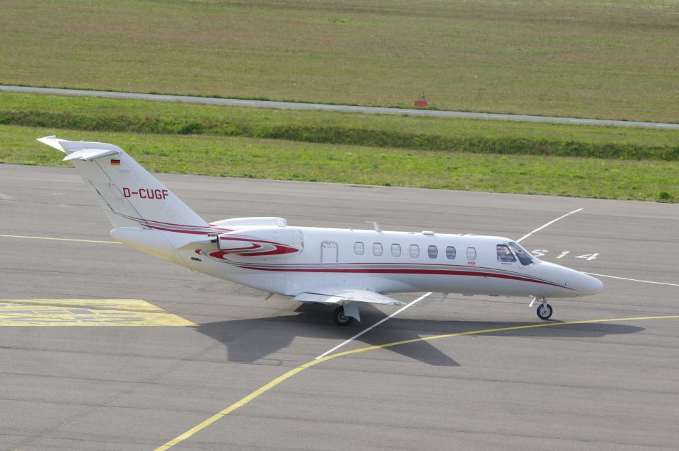 A stock photo of a white and red Cessna CJ3+.