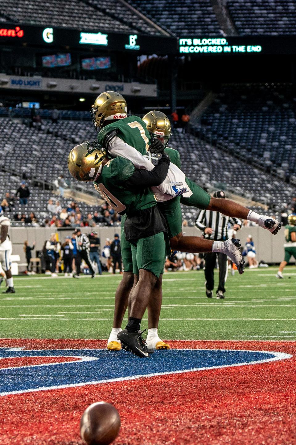 St. Joseph Regional plays Donovan Catholic in a football game at MetLife Stadium East Rutherford, NJ on Friday September 30, 2022. SJR #7 Makhi Jones is lifted into the air after scoring a touchdown. 