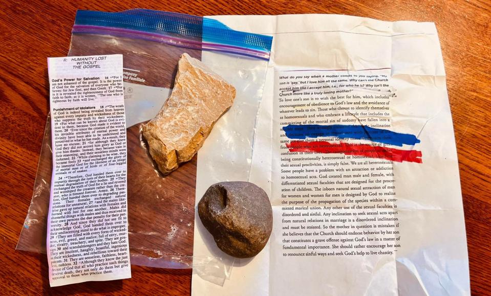 The letter and rocks that Mitchell Olson found in his front yard targeting him and his husband for being gay.