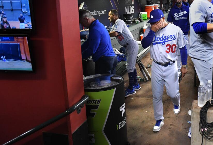 PHOENIX, AZ - October 11: Los Angeles Dodgers manager Dave Roberts reacts to losing.