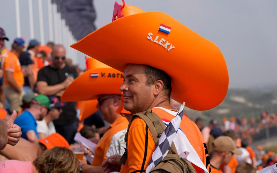 Fans on the stands wait for the start of the Formula One Dutch Grand Prix auto race, at the Zandvoort racetrack, in Zandvoort, Netherlands, Sunday, Sept. 4, 2022 - Peter Dejong/AP