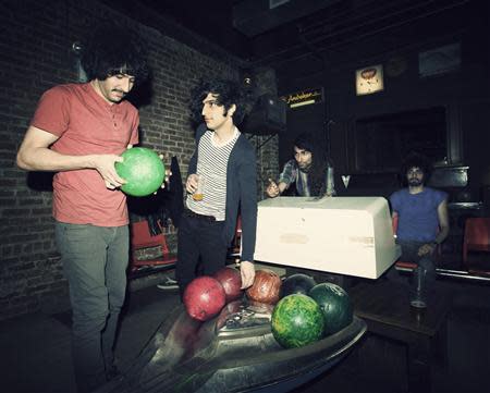 Members of indie band the Yellow Dogs, (L-R) Soroush Farazmand, Koory Mirz, Siavash Karampour and Arash Farazmand are shown at The Gutter bowling alley in Williamsburg neighbourhood in New York in 2011, in this picture released to Reuters on November 11, 2013. REUTERS/Danny Krug/Handout via Reuters